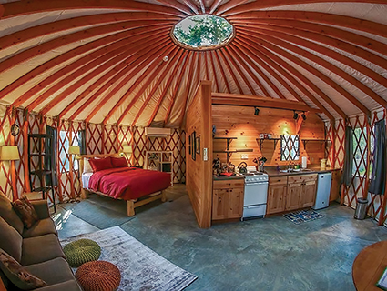 The traditional yurt structure creates a cozy circular sanctuary. Photo courtesy Acadia Yurts & Wellness Center