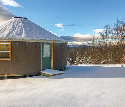 Birdsong Yurt boasts an expansive view across Maine's lakes region toward the slopes of Mount Abram's ski area. Photo courtesy Acadia Yurts & Wellness Center